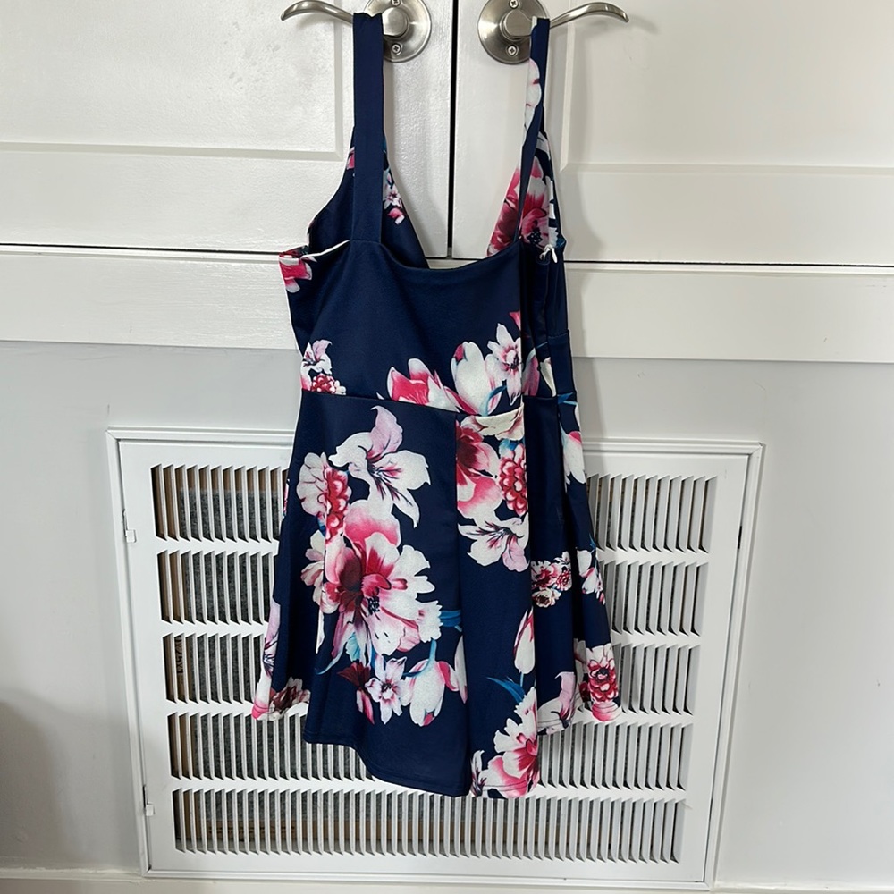 Relipop.  Blue flowered romper. NWOT.